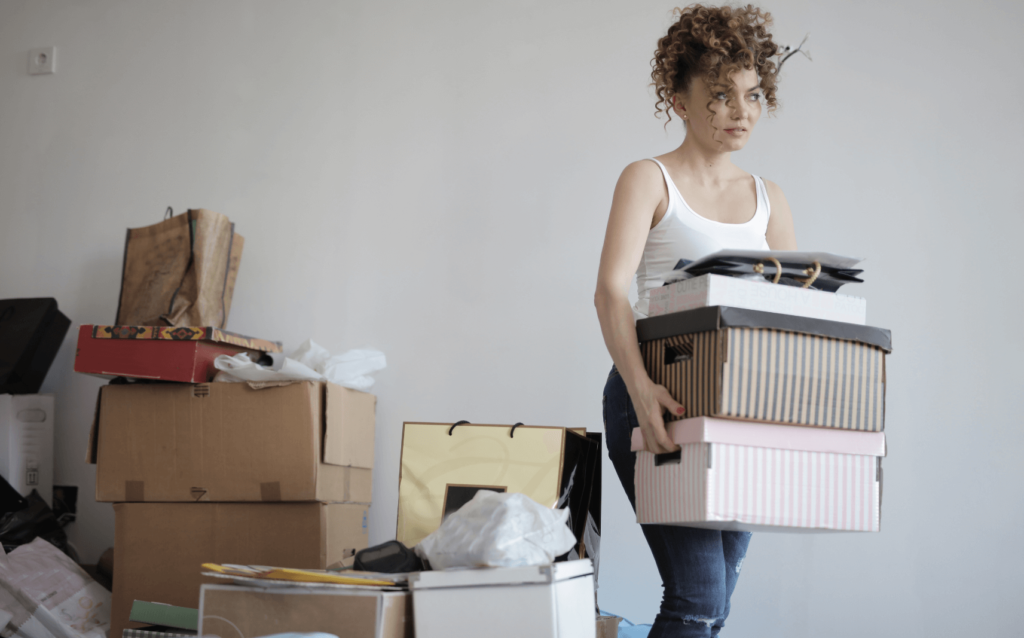 a girl overwhelmed by clutter because she doesn't know the basics of minimalism